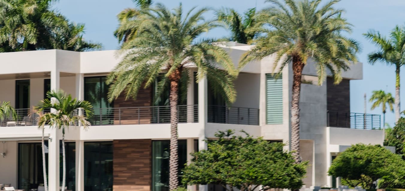 Modern white house surrounded by palm trees in Miami